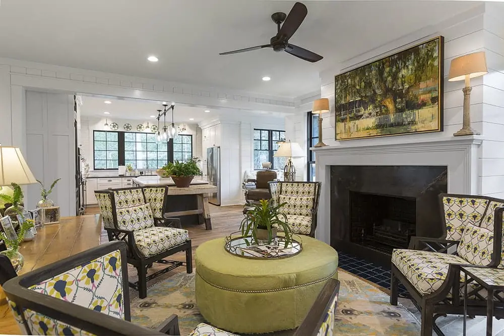 1-2_optimized Art above fireplace mantle in luxury green sitting room
