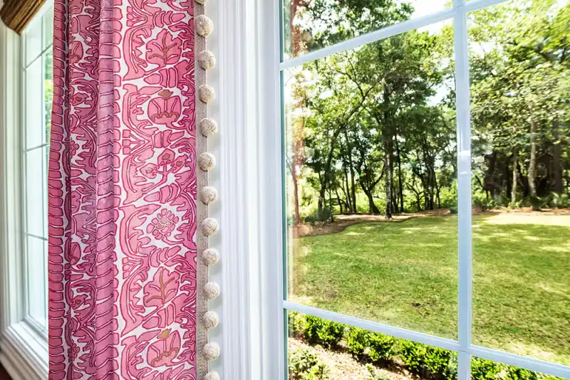 45_optimized Brightly colored curtains with an interesting pattern set the tone for this design