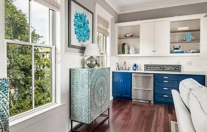 jul-blog-img_optimized bright teals and blues in this room give it the pop of color it needs to feel lively and inviting