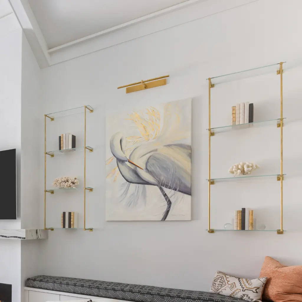 A closer shot of the artwork in this contemporary coastal living room by CHD's interior designers, contrasting sleek lines with soft imagery and colors