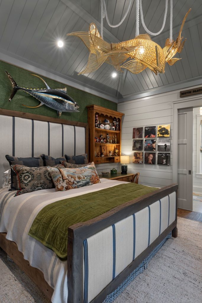 green grass cloth, olive velvet, and navy ticking stripe bedroom by Palm Beach interiors