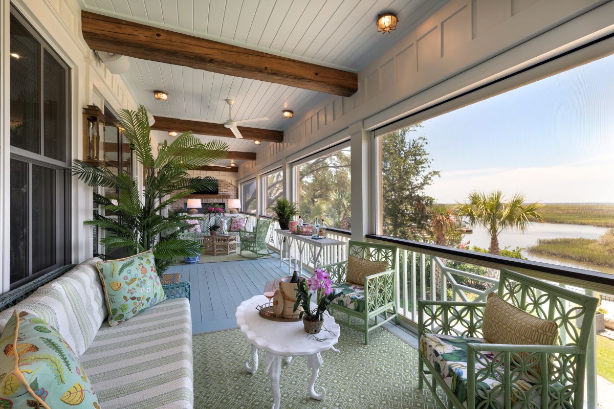The porch of a waterfront home styled with Palm Beach interior design in Georgetown, SC